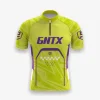 Jersey sepeda custom atau jersey road bike Genethics 2026 warna hijau ungu dengan bahan quick-dry breathable untuk bersepeda dan aktivitas olahraga lainnya (Tampak Depan).